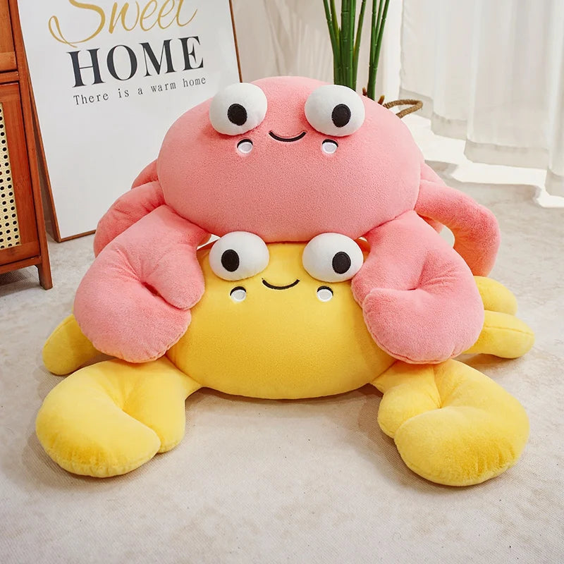 Kawaii plush crab toy with pink and yellow colors on a light-colored floor.