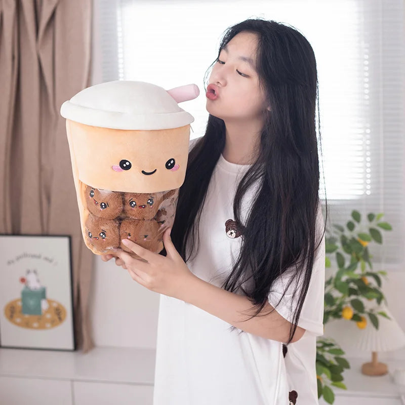 Woman sucking a straw of a kawaii plush toy