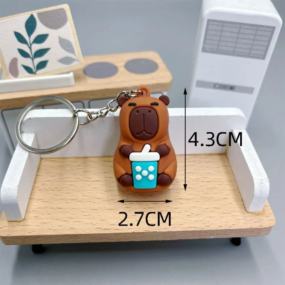 Keychain with kawaii bear design and measurements on a wooden stand