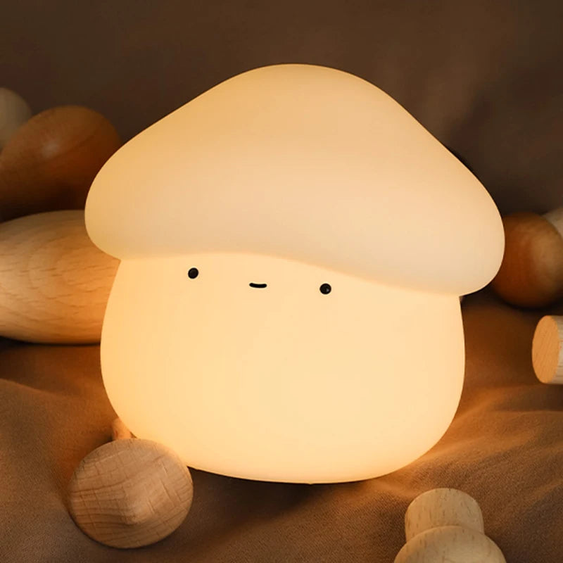 Mushroom-shaped kawaii night light with a soft glow on a wooden surface