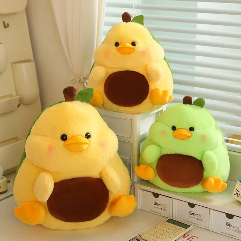 Three kawaii plush toys shaped like ducks on a desk with a window in the background.