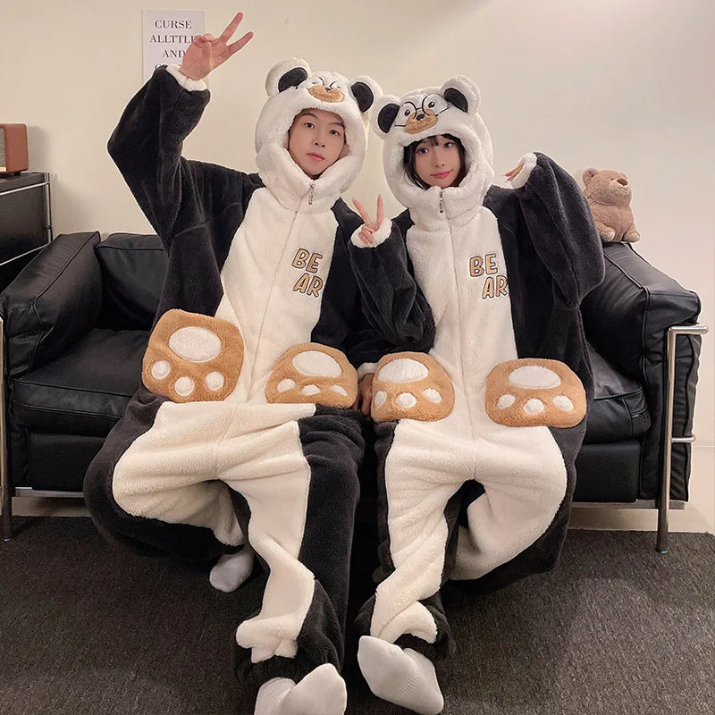 Two people wearing kawaii panda-themed onesies with mushroom design in a living room.