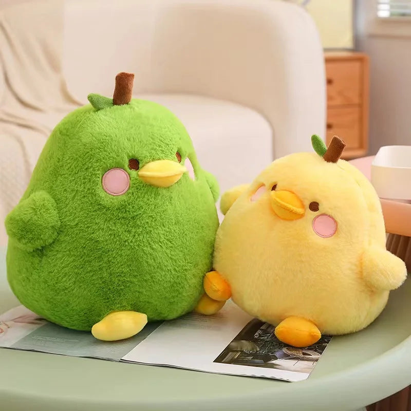 Two kawaii plush toys, one green and one yellow, sitting on a surface with a neutral background.