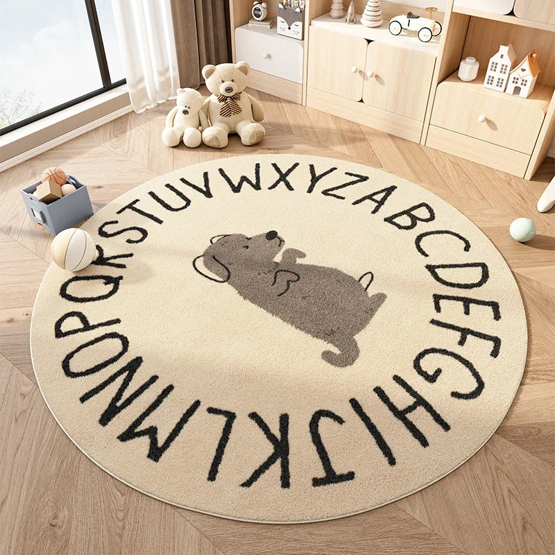 Round kawaii rug with alphabet and dog illustration on a wooden floor in a room with toys and furniture.