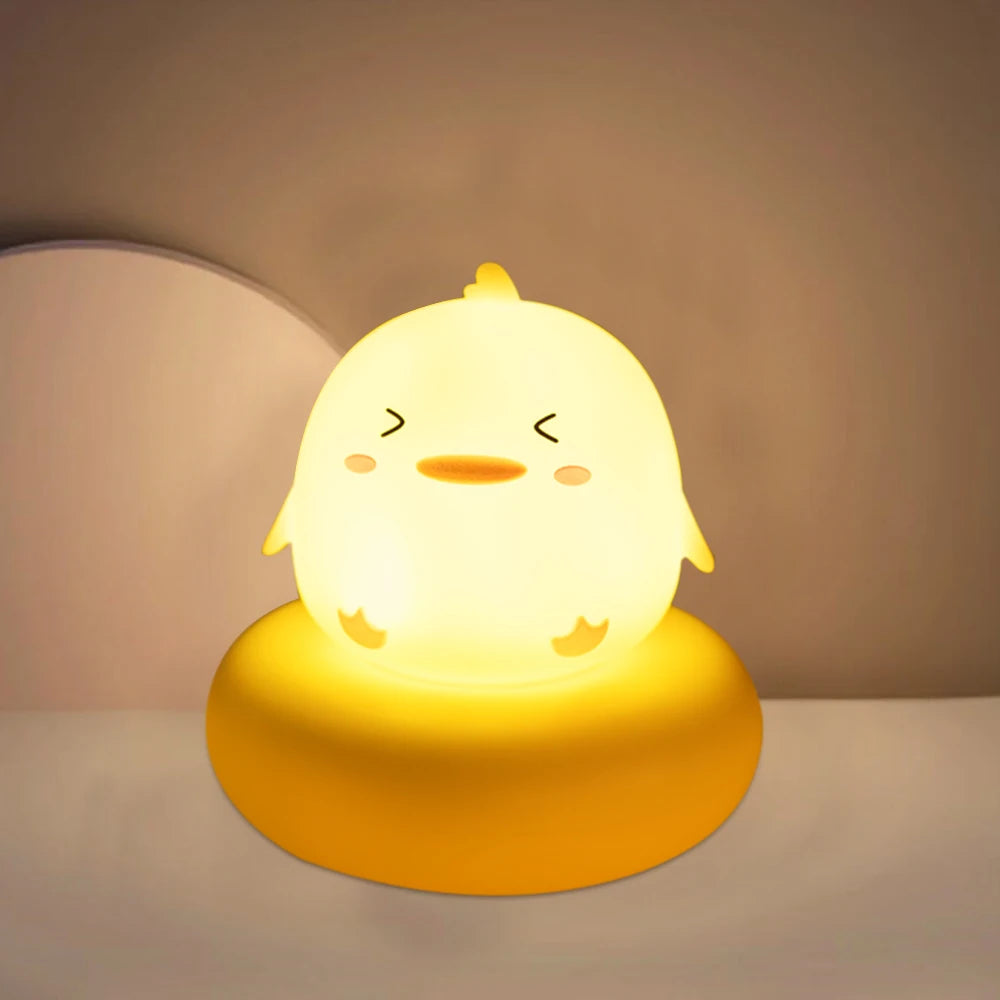 Cute kawaii chick-shaped night light on a plain background