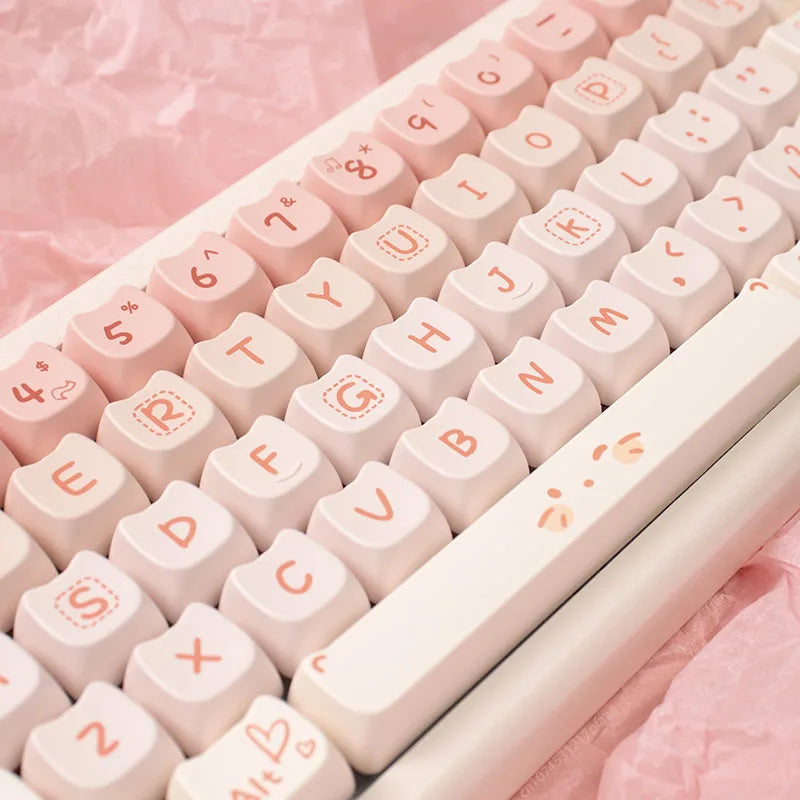 Close-up of a pink Kawaii keyboard with white keycaps on a pink background