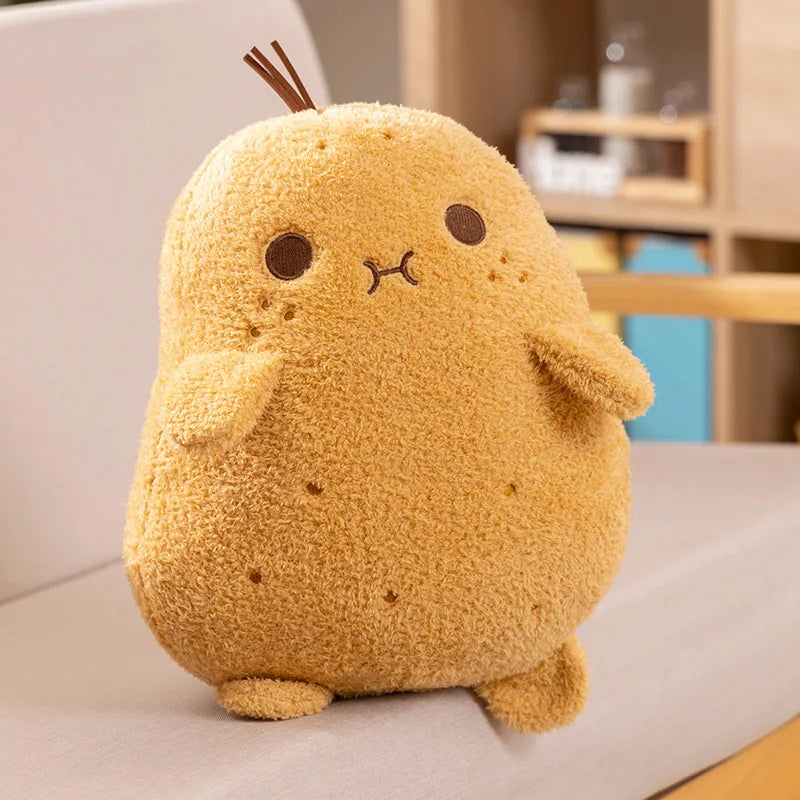 Yellow plush kawaii toy resembling a cartoon character on a light surface.