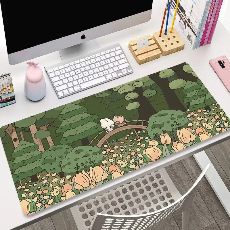 Desk setup with a Kawaii nature-themed mouse pad, computer, and office supplies.