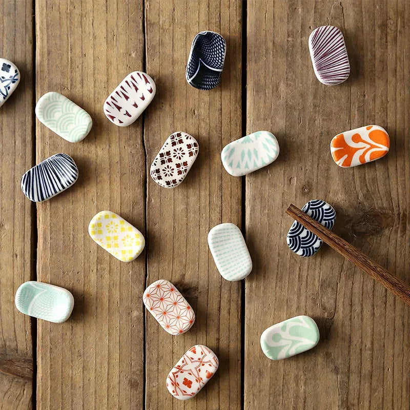 Decorative kawaii stones with various patterns on a wooden surface