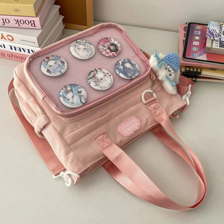 Pink Kawaii handbag with decorative elements on a light surface