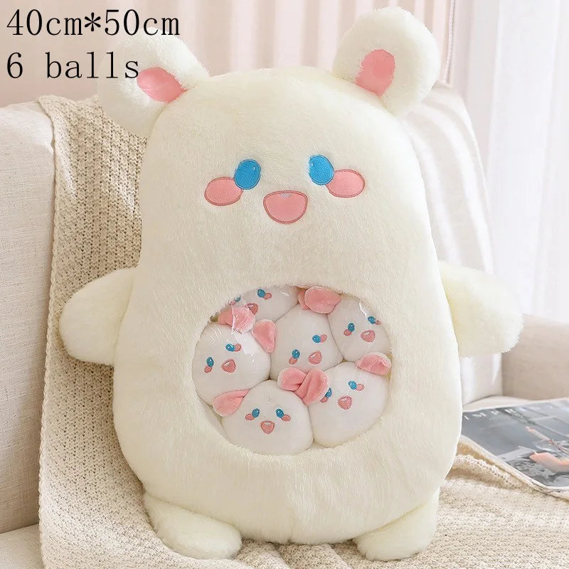 Plush toy with kawaii cartoon face on a couch