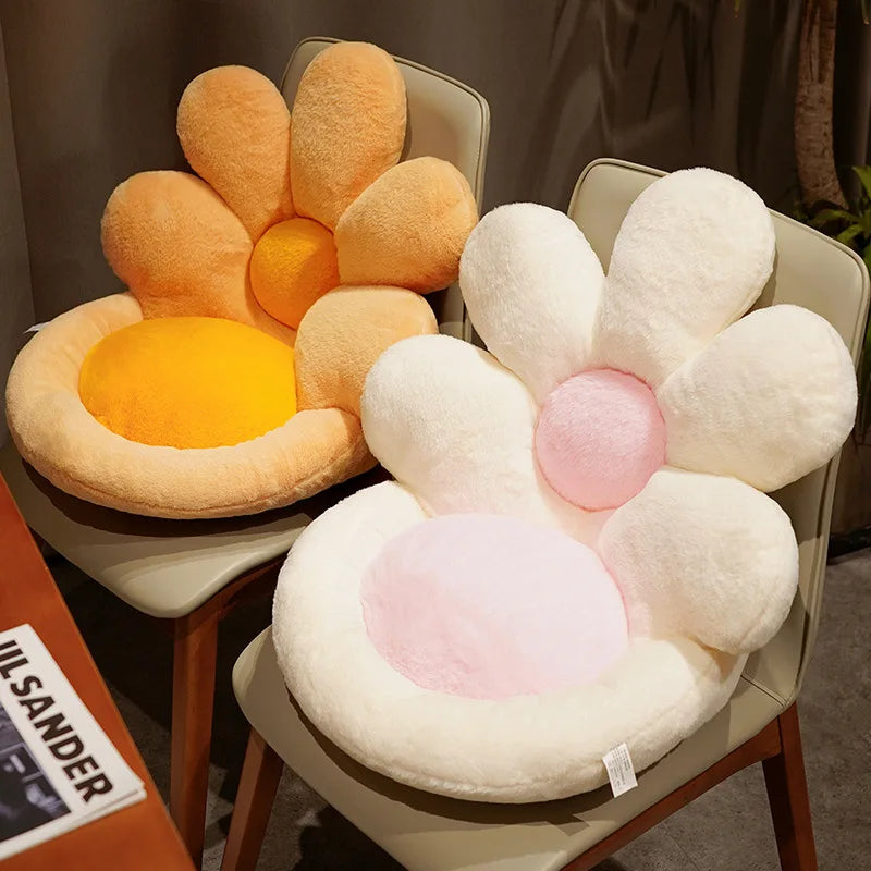 Two flower-shaped kawaii cushions on chairs with a blurred background