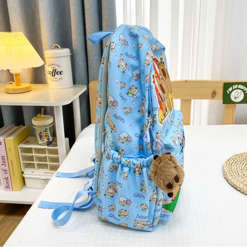 Blue drawstring Kawaii bag with teddy bear pattern on a white surface