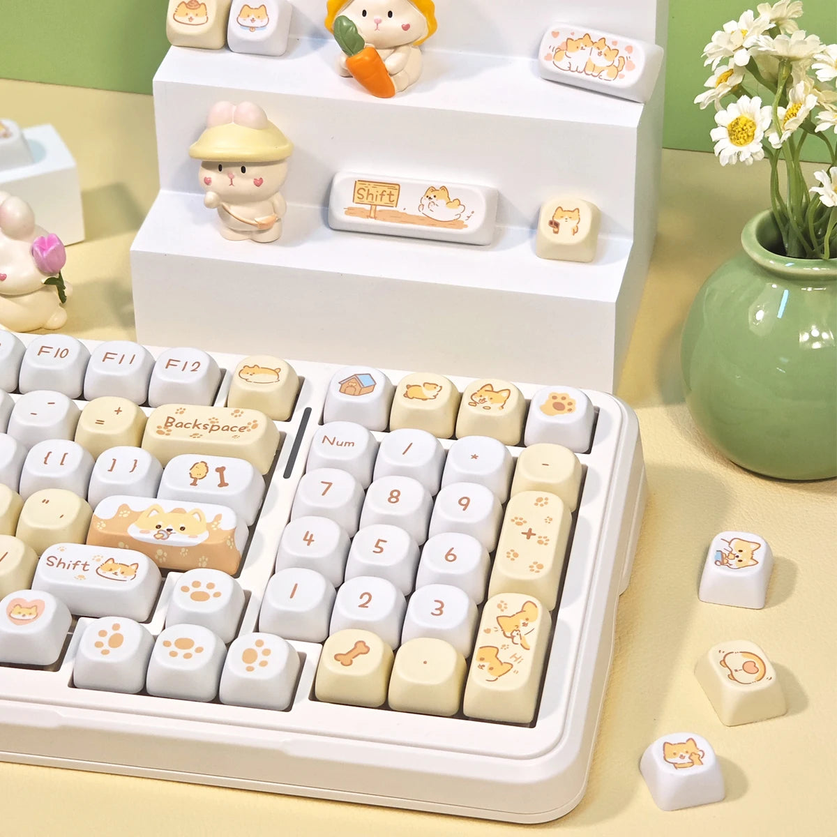 Keyboard with Kawaii cute keycaps on a desk with decorative items