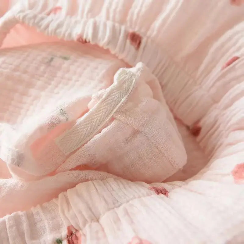 Close-up of pink kawaii textured fabric with floral patterns