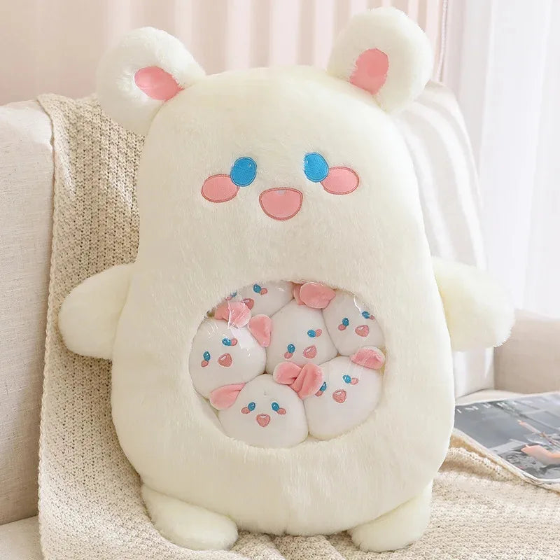 Cute kawaii plush toy with bear ears and face on a couch