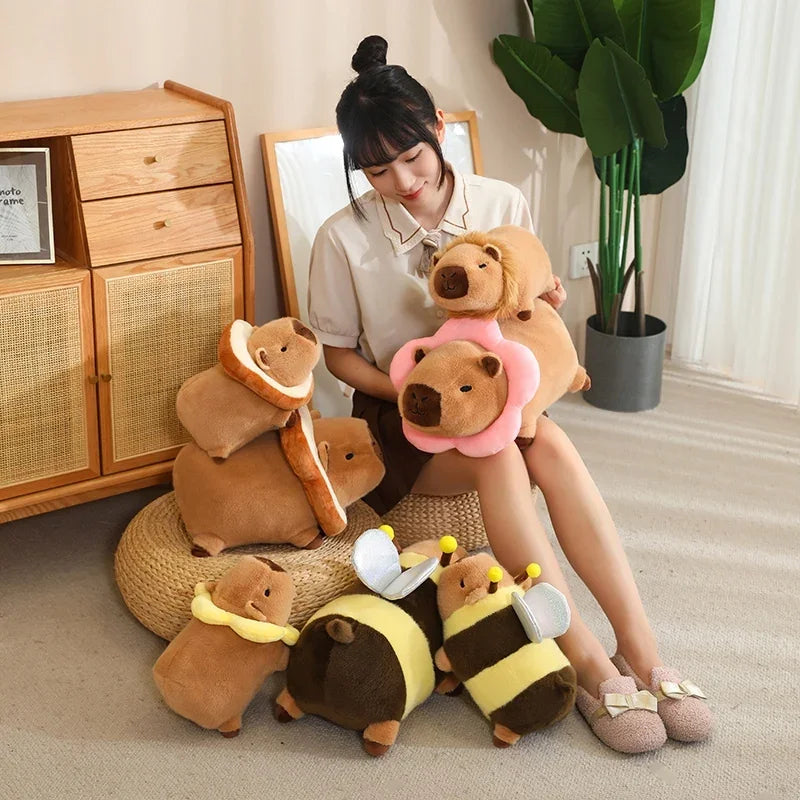 Woman sitting on the floor with various kawaii plush toys in a room with wooden furniture and a plant.