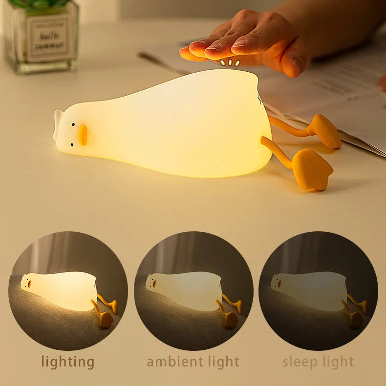 Cat-shaped kawaii night light with different lighting modes on a table.