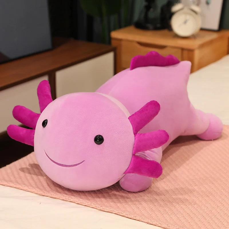 Pink axolotl plush kawaii toy on a pink blanket