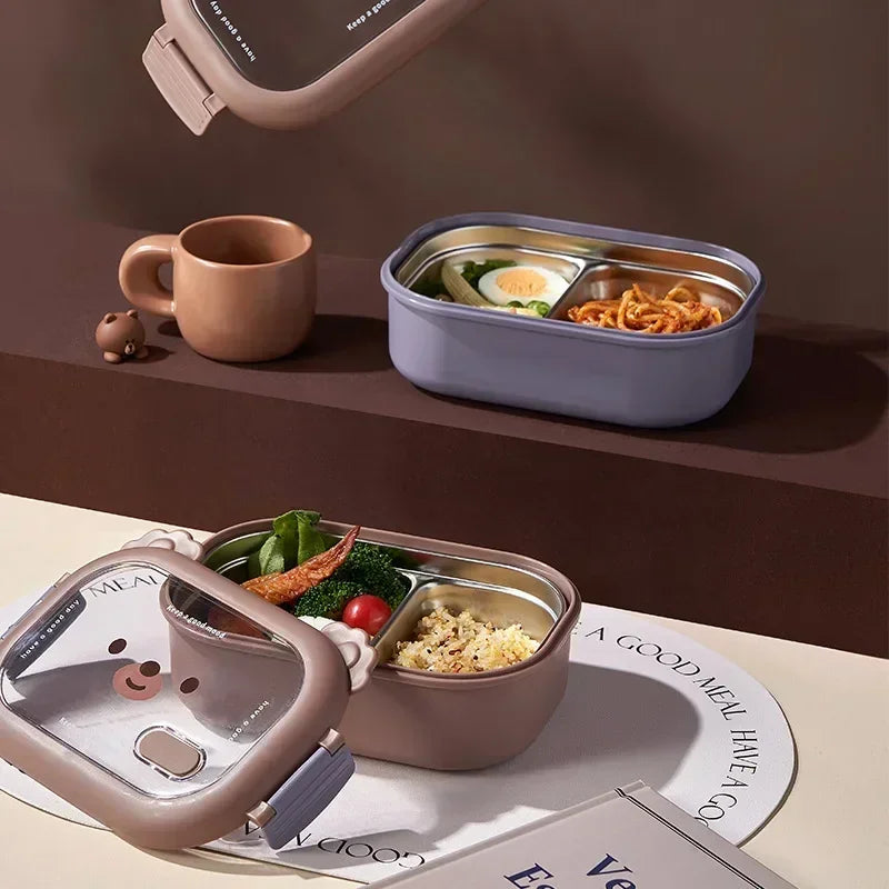 Two kawaii bento boxes with food on a table with a brown background