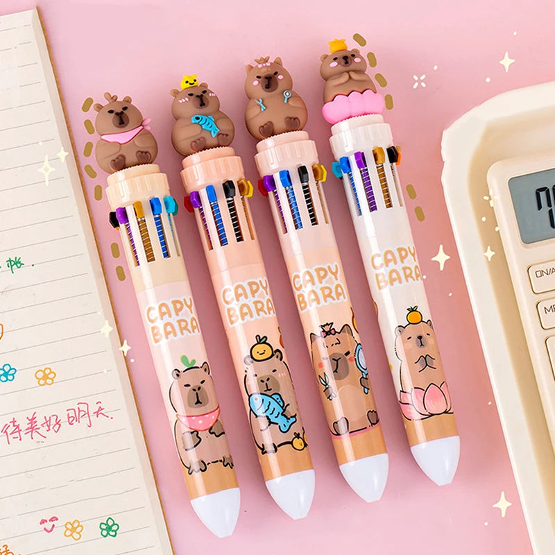 Set of kawaii cartoon bear-themed pens on a pink background with stationery items.