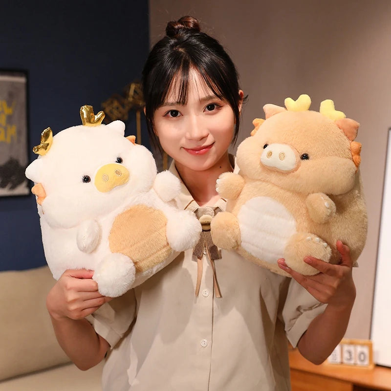 Woman holding two kawaii plush toys resembling pigs with a crown and bow tie.