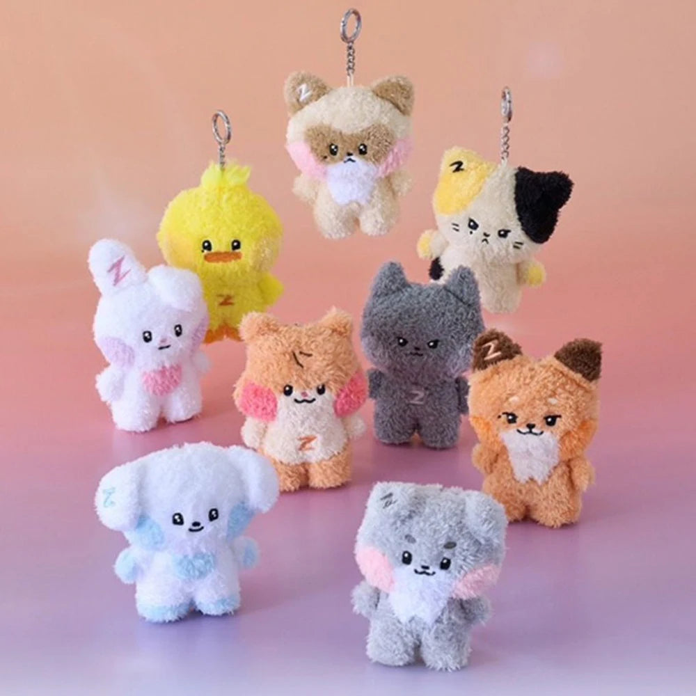 Collection of small kawaii plush toys with various designs on a gradient background