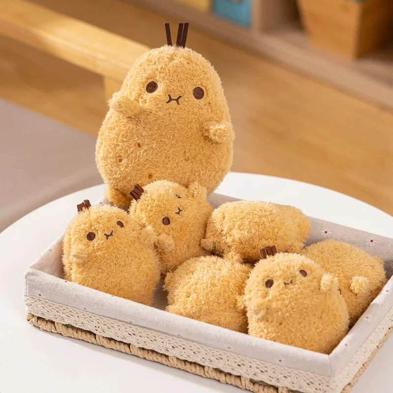 Set of plush kawaii toys resembling small animals with a soft texture on a white surface.
