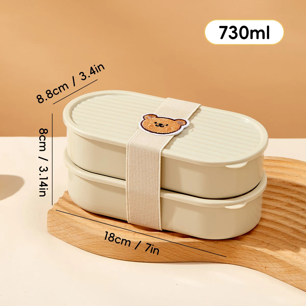 Beige kawaii bento box with a bear design on a wooden stand, showing measurements and capacity details.