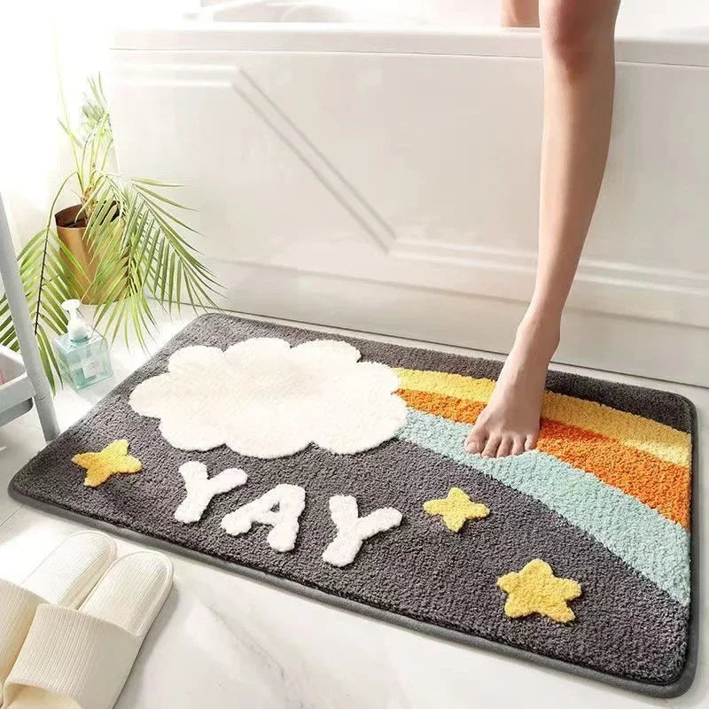 Decorative Kawaii doormat with cloud, 'YAY', and rainbow design on a floor.