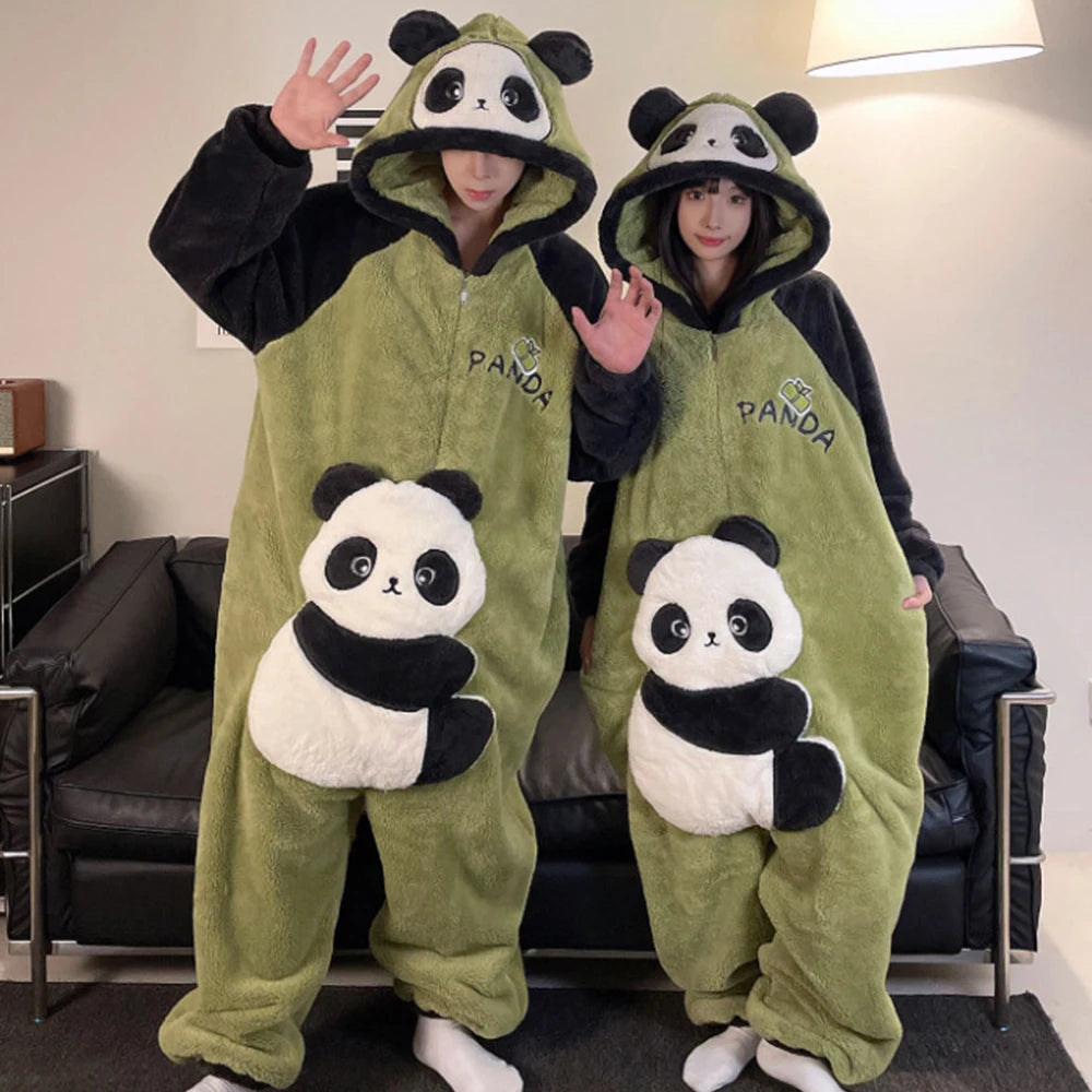 Two people wearing green kawaii panda-themed onesies in a living room.