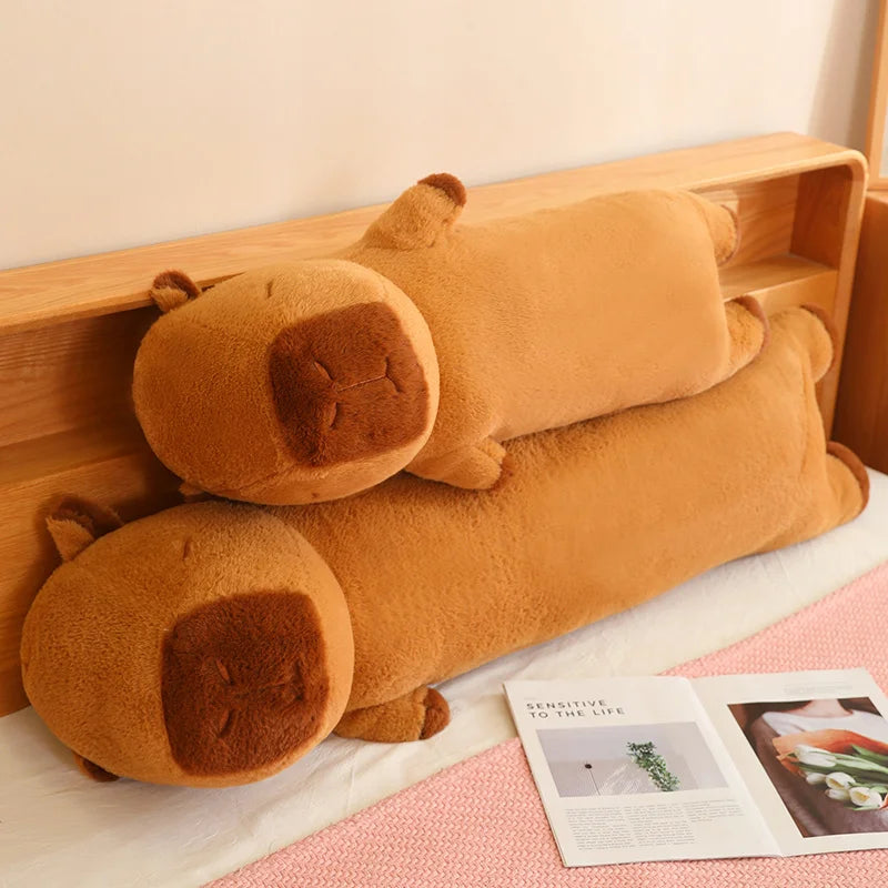 Brown kawaii plush dog-shaped pillow on a bed with a wooden headboard.