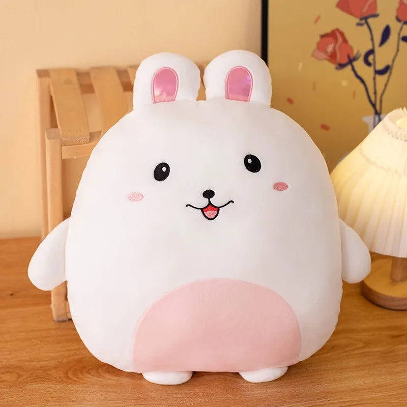 Cute kawaii plush toy with pink cheeks and white ears on a wooden surface.