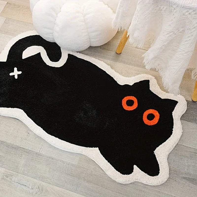Black cat-shaped kawaii rug with orange eyes on a wooden floor.