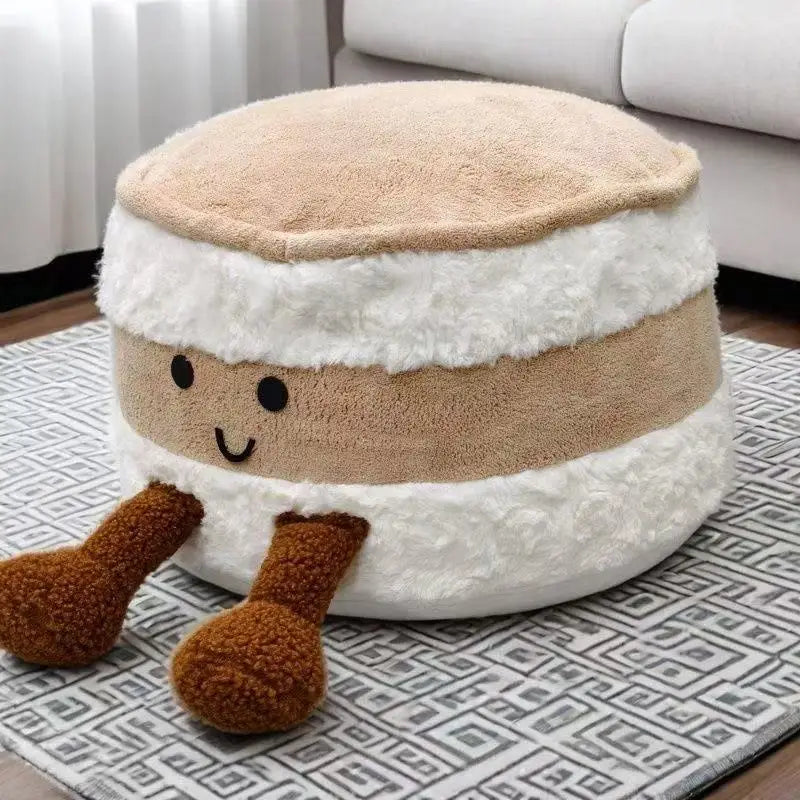 Round kawaii plush ottoman with a face on a patterned rug