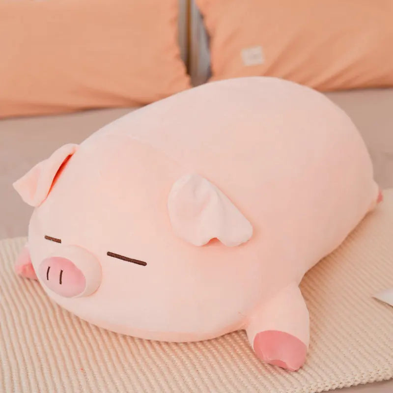 Kawaii plush pig pillow on a bed with pink pillows in the background