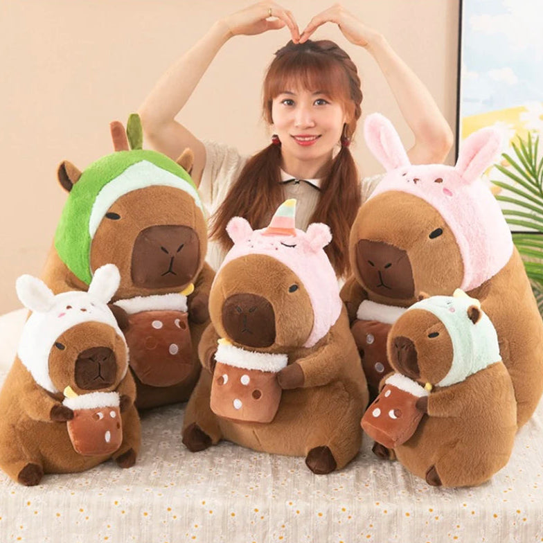 Woman with kawaii plush toys resembling animals in costumes on a light background