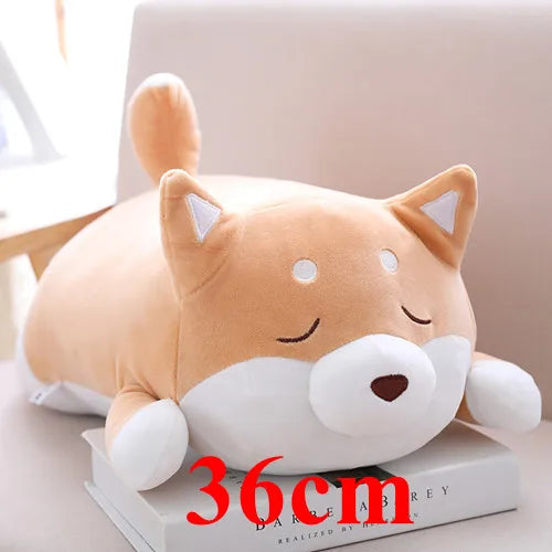 Plush dog-shaped kawaii pillow on a book with '36cm' text