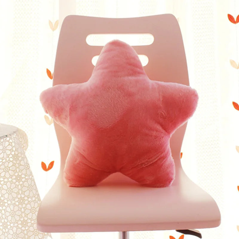 Pink star-shaped Kawaii pillow on a chair with a soft focus background