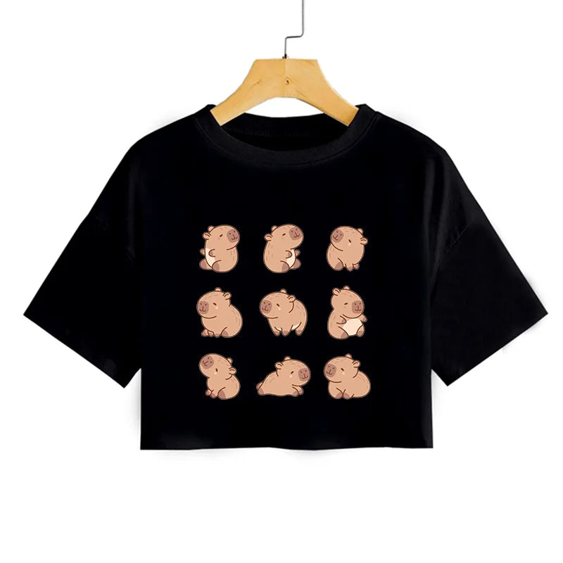 Black t-shirt with cartoon kawaii pig designs on a hanger against a white background