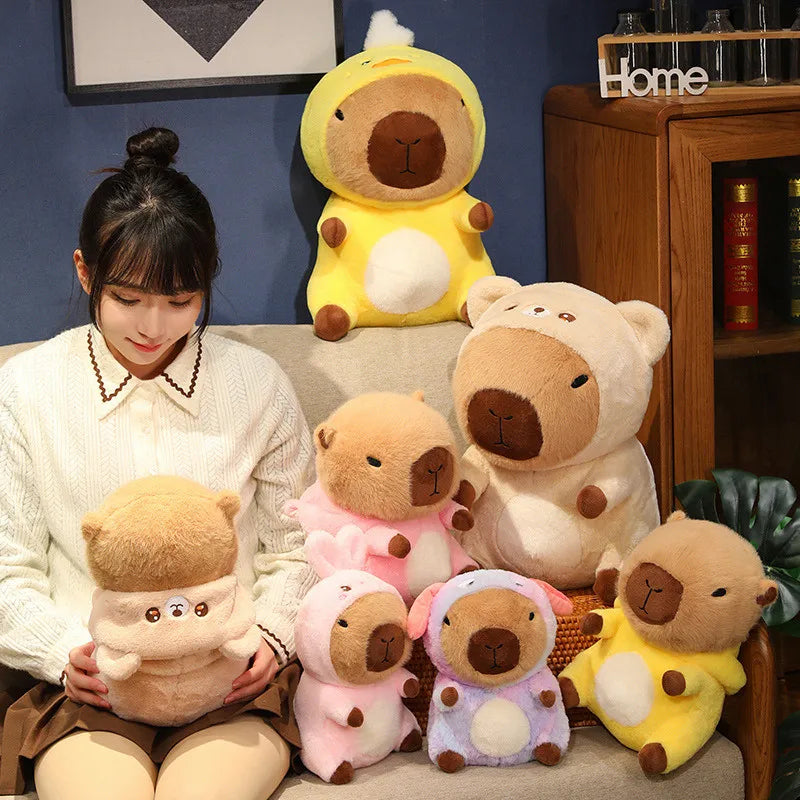 Woman sitting on a couch with a collection of kawaii plush toys resembling bears and a duck.