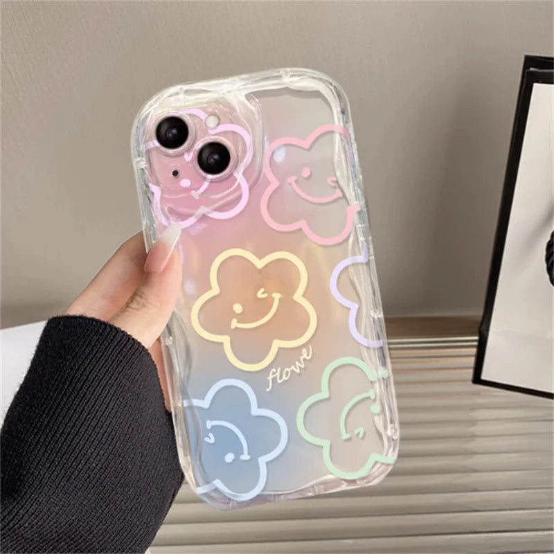Phone case with kawaii smiley face designs held by a hand on a neutral background