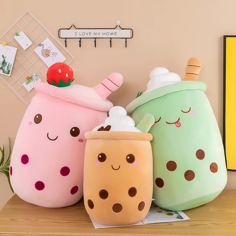 Three kawaii plushies in the shape of boba tea