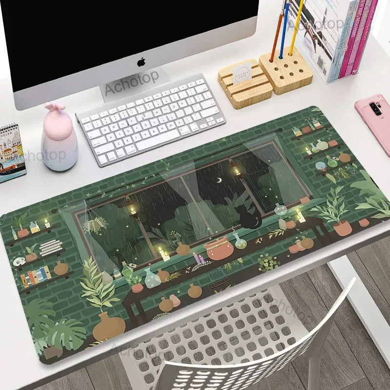 Desk setup with a Kawaii decorative mouse pad featuring a window view and plants.