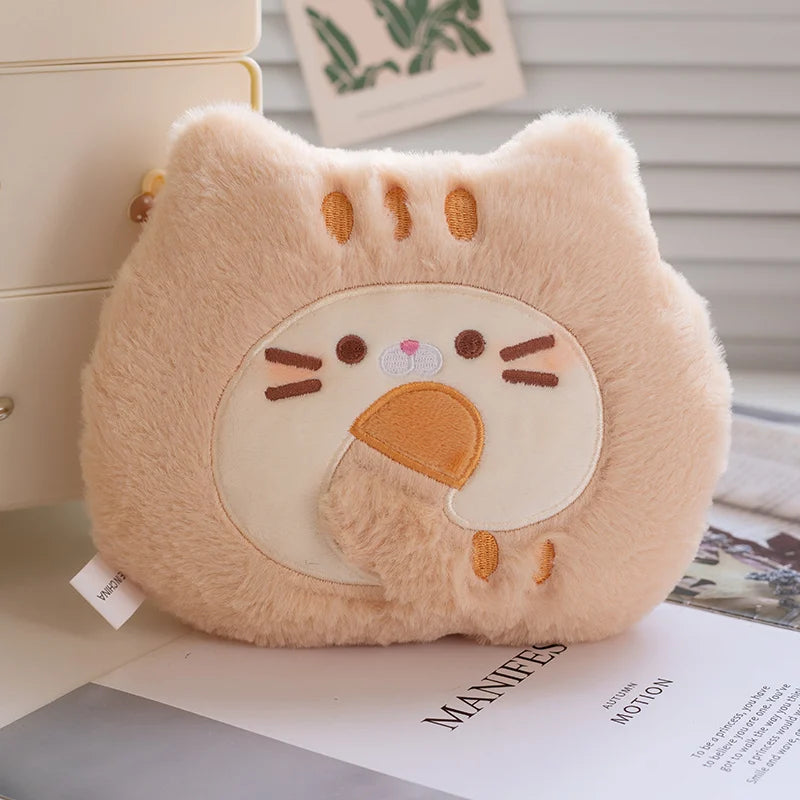 Plush toy with a cartoon face kawaii design on a surface