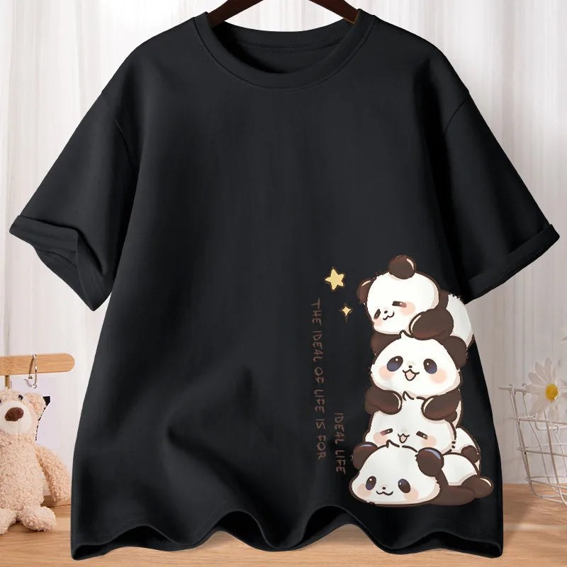 Black t-shirt with kawaii panda design on a wooden surface