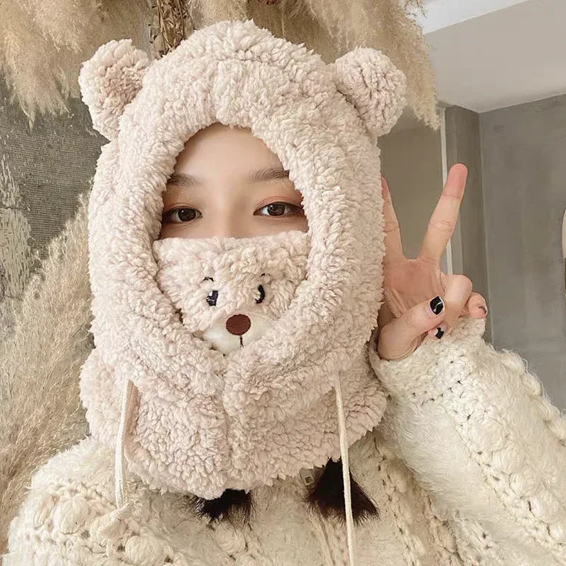 Person wearing a fluffy Kawaii bear-themed hooded outfit, making a peace sign.