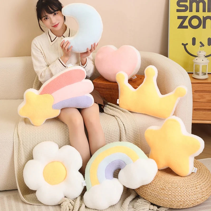 Woman sitting on a couch with various colorful kawaii plush toys shaped like stars, flowers, and moons.