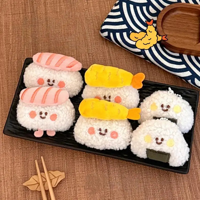 Plated set of kawaii cartoon-style rice balls with faces and accessories on a wooden surface.