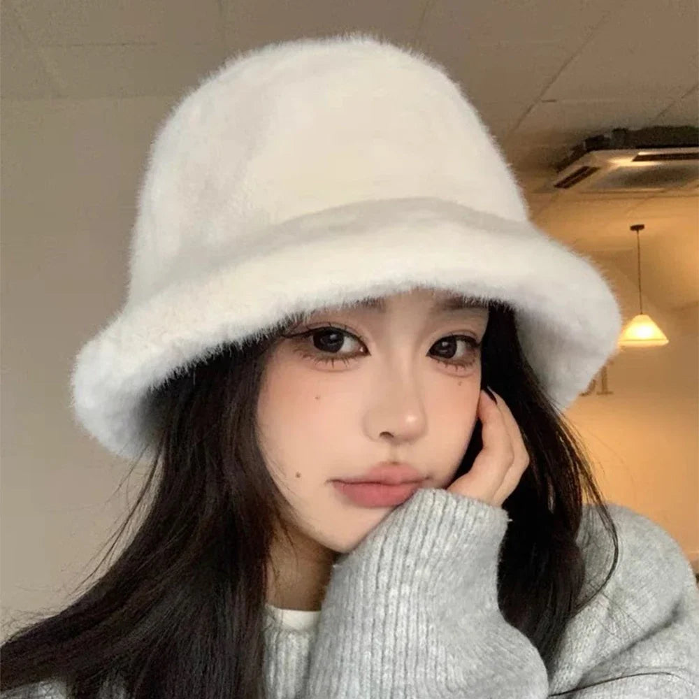 Person wearing a white Kawaii fur hat indoors